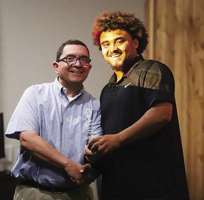 Aden Parish racked up awards from multiple sports at last week’s banquet, including the Rabi Estes Award. He is pictured with Dr. Mike Irvin.