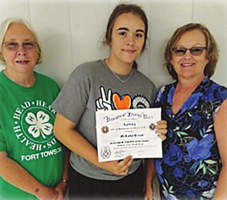 VFW VOICE OF DEMOCRACY ESSAY contest third place winner was Fort Towson resident McKayla Brents, representing Fort Towson High School. Presenting her certificate of achievement are President Tammy Edwards and Trustee Alicia Brents.