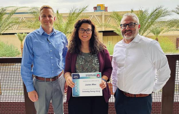 Hugo Kiamichi Technology Center employee Lauren Wren received the 2023 PACE Outstanding Training Activity award for the Electrical Lineman Training Program during the Association of Career and Technical Education’s annual VISION conference in Phoenix, Ariz. Wren is the Workforce &amp; Economic Development Coordinator at Kiamichi Tech – Hugo. Pictured with Wren are Hugo campus director Jerrod Lundry (left) and Workforce &amp; Economic Development Director Jacob Poole.