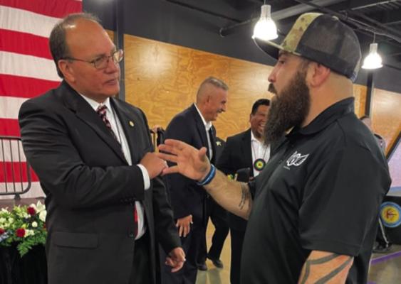 Choctaw Nation Chief Gary Batton discussing the implications of using the Q Actual app with the app’s creator, Aaron Quinonez.