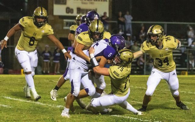 HUGO’S CHANCE MARZEK continues to lead the Buffalo defense with tackles, following a solid game against the Wilburton Diggers Friday. Above, Marzek is assisted by Ashton Barnett to take down a Wilburton ball carrier, while Pierson Evans and Aden Parish close in for the assist. Hugo News Photos / Bobby Hamill