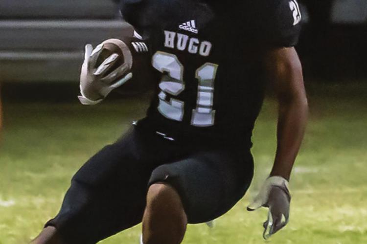 ZAN COOK turns the corner and looks for running room for the Hugo Buffalo offense in the first round of the State Playoffs in Hugo Friday against the Keys Cougars. Cook finished the game with 49 yards on 11 carries.