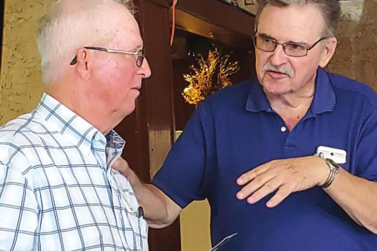 FOR THE HORSES — Tulsan Rich Stephens enjoys a moment talking with Bryant Rickman, of Hugo, about a subject they both love and enjoy — Spanish Mustangs... during a recent luncheon in Hugo. Photos Courtesy: Dianne Weeks