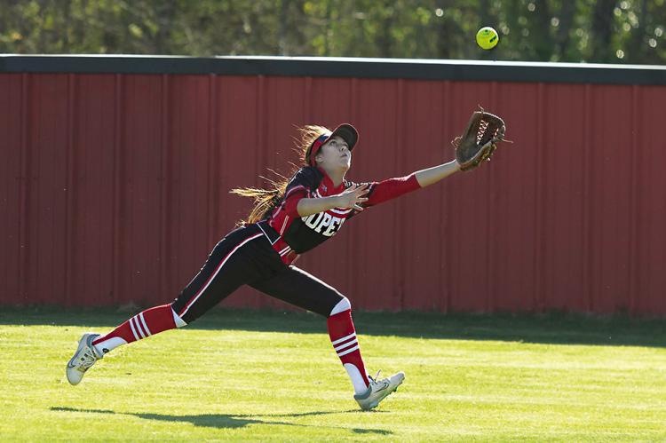 BELOW... ALEXIA ROUSE stretches to pull down a hard-hit fly ball to her outfield position for the Soper Lady Bears as they battled Stratford on their home field last week.