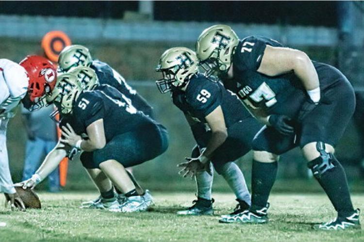 HUGO BUFFALO LINEMEN battling in the trenches for the offense this season include center Jayse Trantham (soph.), left guard Jonathan Chavez (soph.), and left tackle Connor Frazier (junior). The Buffaloes rushed the ball 31 times for 155 yards on the ground against the Warriors. Hugo News Photo / Bobby Hamill