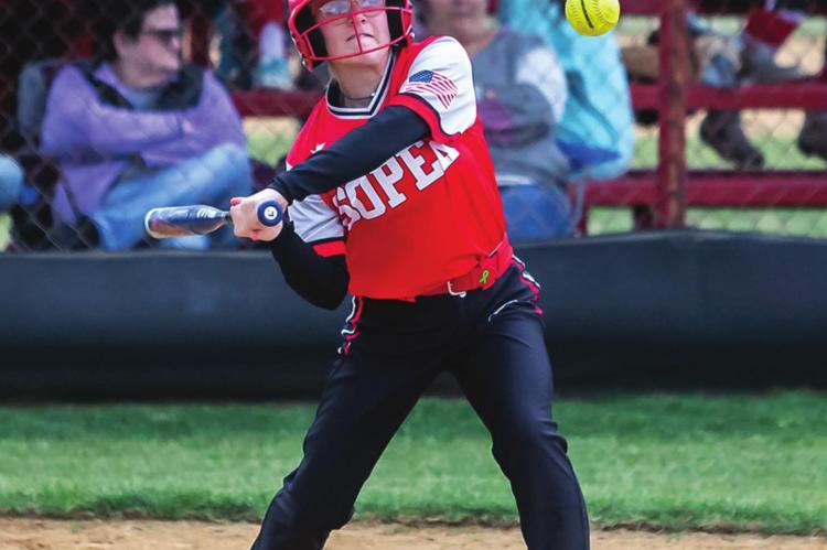 JAYLEE CAMPBELL carefully watches a pitch as the Soper Lady Bears battle the Crowder Lady Demonettes last week on their home field. Jaylee scored a run for Soper in the second inning as Soper posted a solid 11-3 victory.