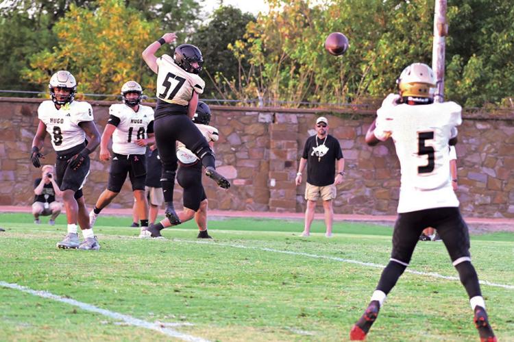 BUFFALO QUARTERBACK JAYKA SANTILLAN connects with wide receiver Gion Balcazar during Friday’s scrimmage against McAlester. Santillan, a senior, has four years QB experience under his belt and will be a force for opposing defenses to reckon with this football season. Hugo News Photo / Stan Stamper