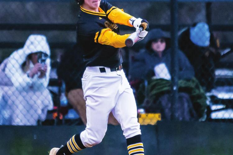 JESSE GARDNER puts the bat on the baseball during the Boswell Scorpions against the Fort Towson Tigers during recent baseball action between the two rivals.