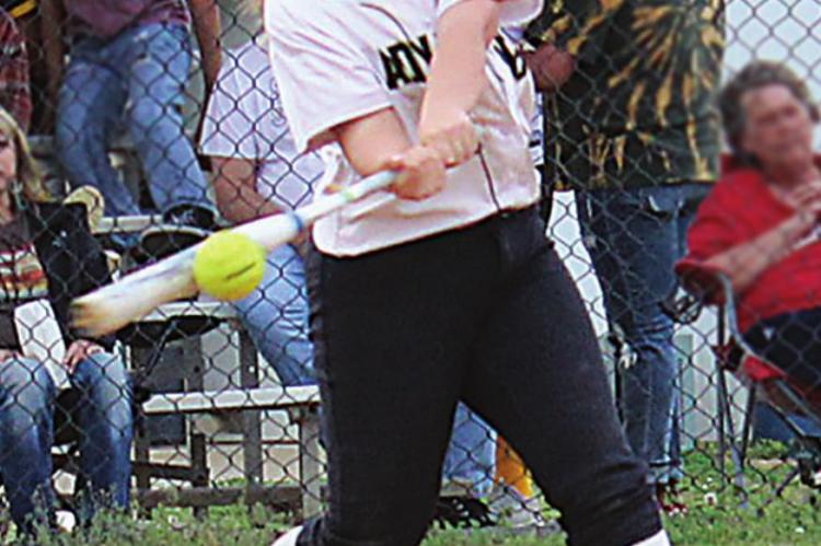 ALLEY IVEY steps into a pitch for the Hugo Lady Buffaloes during recent softball action in Boswell. Hugo defeated Boswell, 8-6, but lost to Soper’s Lady Red Bears, 13-3. (Brian Moore Photo)