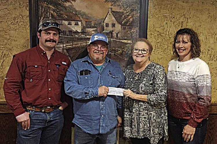 Kiamichi Conservation District presented a check on Feb. 15 for $29,186.69 to Jim Bob Sullivan, Choctaw County District 1 Commissioner, for an unpaved road project sponsored by the Oklahoma Conservation Commission. Pictured are John McQuaig, Sullivan, Lisa Payne and Kylee Edge.
