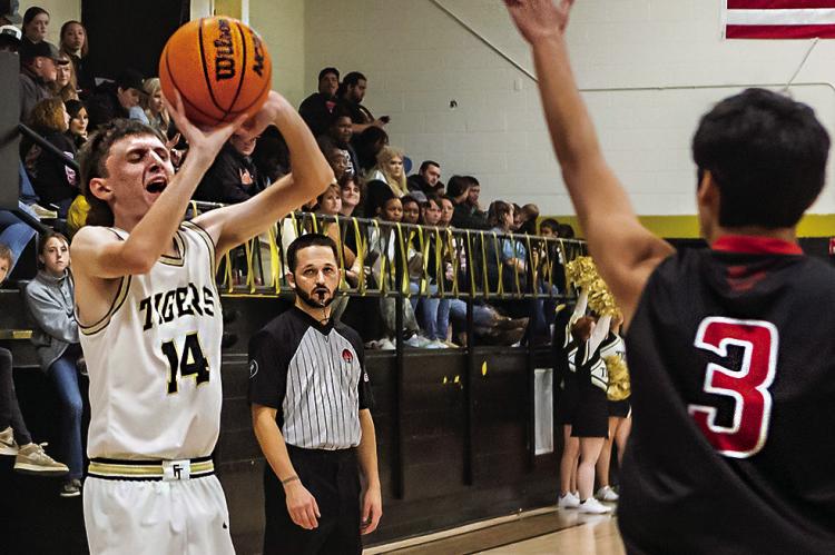 JESSE! JESSE! JESSE! — Fort Towson fans put a big cheer on when Jesse Grimes knocked down a big three-pointer last week in the Tigers’ big 61-16 win over Victory Life. Hugo News Photo / Bobby Hamill
