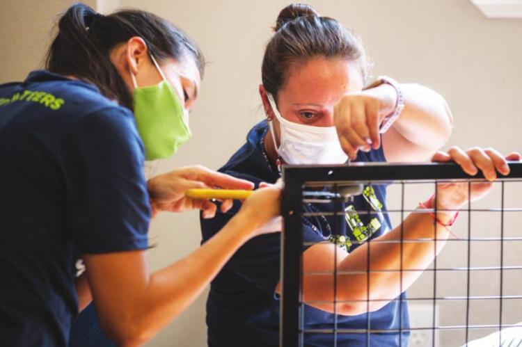 Service to the community is an important aspect of employee culture at Noble Research Institute. Pictured are research associates Maira Sparks (left) and Yanina Alarcon putting together furniture at the Family Shelter of Southern Oklahoma in Ardmore, Oklahoma, as part of an organization-wide opportunity to help the shelter settle into its new location.