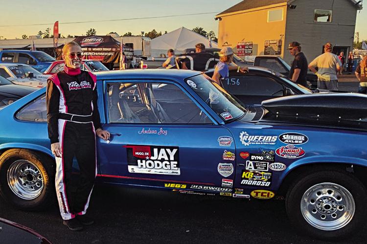 ANDREA RUFFIN takes a moment for a photo while prepping her car “Joy Ride” for the IHRA SUPER SERIES World Finals in Holly Springs, Mo.