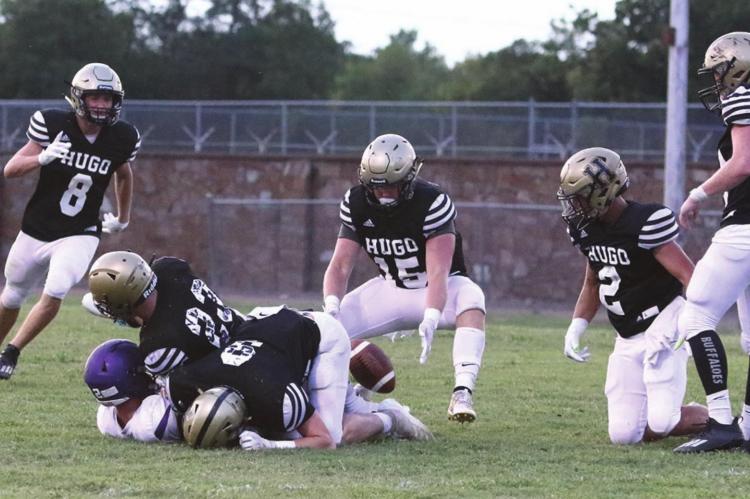 LIGE WHITE puts a fierce tackle on a Coalgate ball carrier, forcing a fumble that is pounced on by teammate Tony Perry during the Buffaloes pre-season scrimmage Friday night in Hugo. Closing in to assist on the tackle were Ashton Barnett, Jace Moffitt, Hunter Sims and Chance Marzek. The Buffaloes open their 2020 fall football season at home Friday, Aug. 28 against Dickson. Kickoff is at 7 p.m. Hugo News Photo / Bobby Hamill