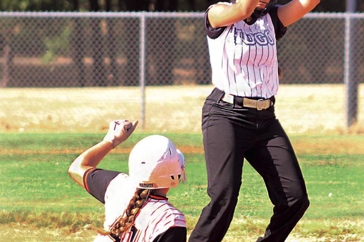 HUGO LADY BUFFALO SENIOR SHORTSTOP KINSLEY JOHNSON takes a high throw to second base to force an out against Valliant in softball action last week in Hugo. Brian Moore Photo