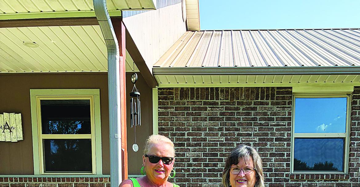Iris Garden Club’s Yard of the Month was awarded to Gail and Shane Allen on Deer Run Rd. The beautifully maintained yard features trees, crepe myrtle’s, roses, zinnias and more. Pictured are Iris Garden Club representative Harolynn Wofford and Gail Allen.