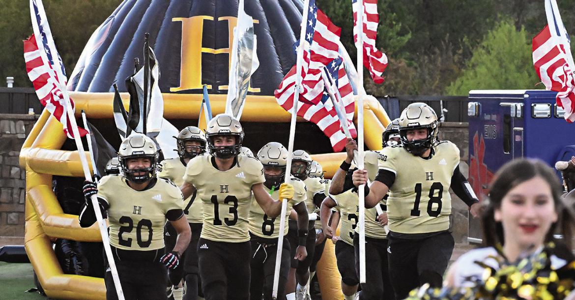 HUGO BUFFALO SENIORS led the Buffaloes onto Buff Parker Field Friday carrying both the nation’s and the school’s colors. Seniors included: Jayka Santillan, Zaven Siniga, Sam Perez, Zakk Gilmore, Ja’Mari Scroggins, Kadyn Jones, Kamarien Pugh, Kamden Bostic, Gunner Santillan and Keiondre Locke. Hugo News Photo / Stan Stamper