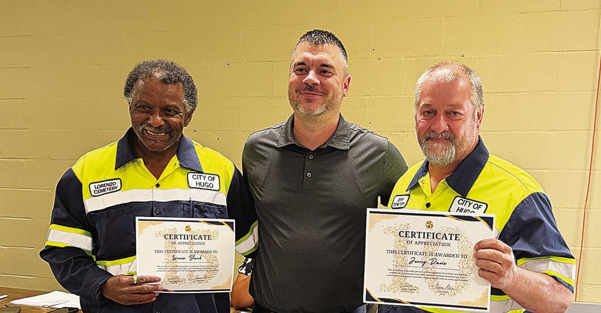 Two city employees received service awards during the most recent Hugo city council meeting. Pictured are (l to r): Lorenzo Black, Hugo city manager Justin Suddeth and Jerry Davis.