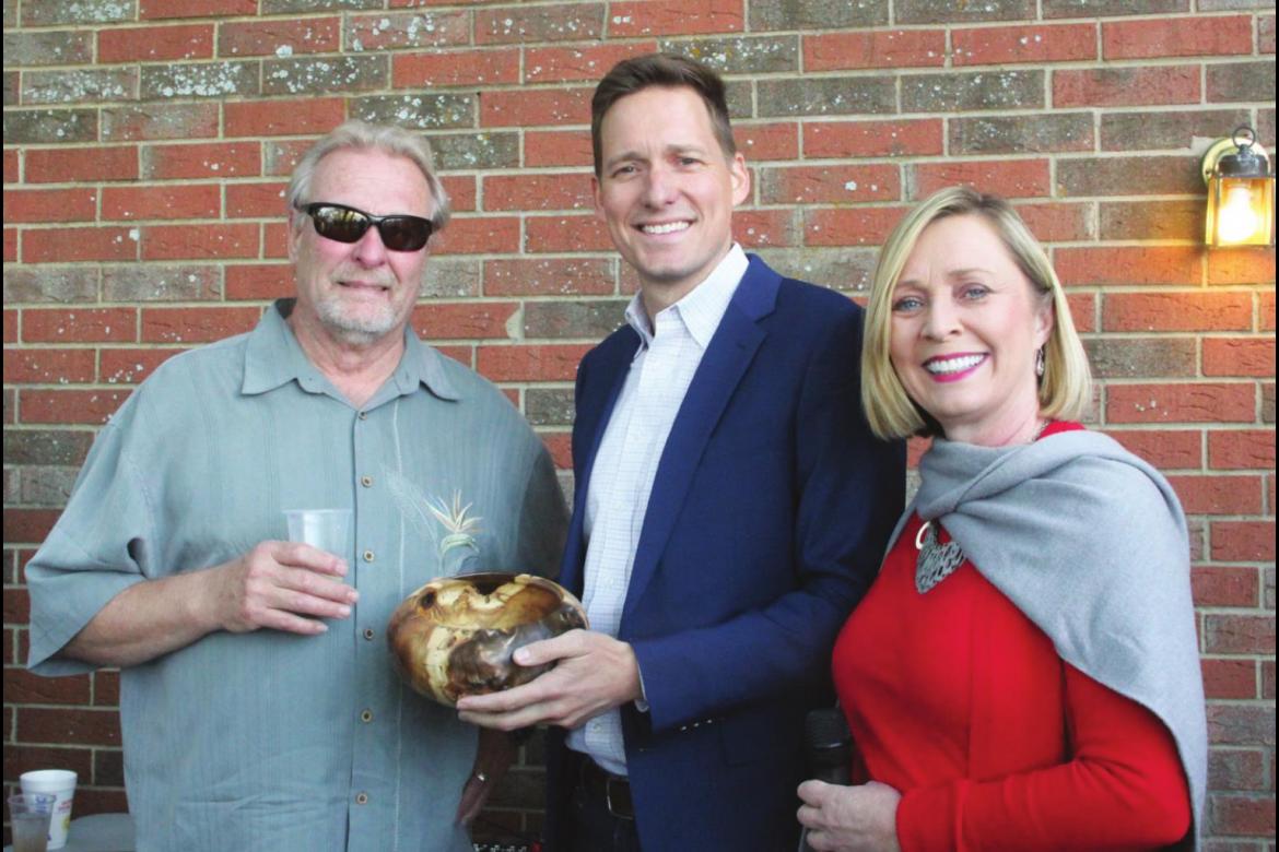 Top: Lt. Governor Matt Pinnell was gifted a hand-made wooden bowl during the annual turkey hunt. The artist was Zack Caruthers of Fort Towson. Also pictured is Sharla Frost.