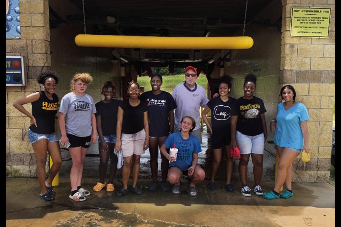 The Hugo Lady Buffs (basketball) held their first fundraiser of the year on July 30 with the help of Buffalo Bay owner Remy Tholen. Pictured above are Tholen, Demiya Akins, Keighanna Kelley, Zariah Ware, Schuynasti Starlin, Keshawna Scroggins, Calista Kelley, Tanea Johnston, Kelicia Cook and Kamarianna Coleman, who all participated in the car wash. The Lady Buffs will soon be out and about around Hugo selling candy bars as their next fundraiser. Hugo News Photos / Kelli Stacy