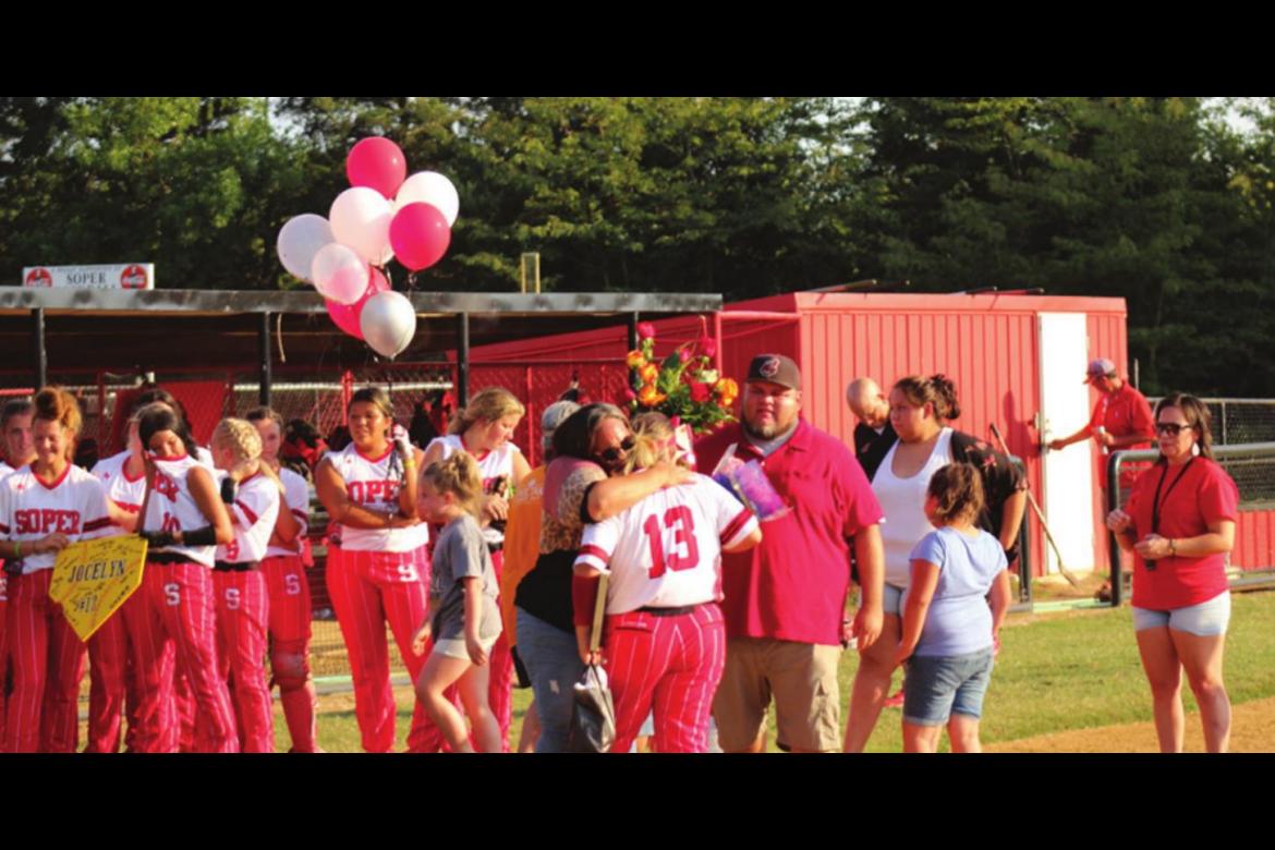 JOCELYN RICE is congratulated by her parents and teammates during Senior Night festivities held by the Soper Lady Bears last week. Brian Moore Photo