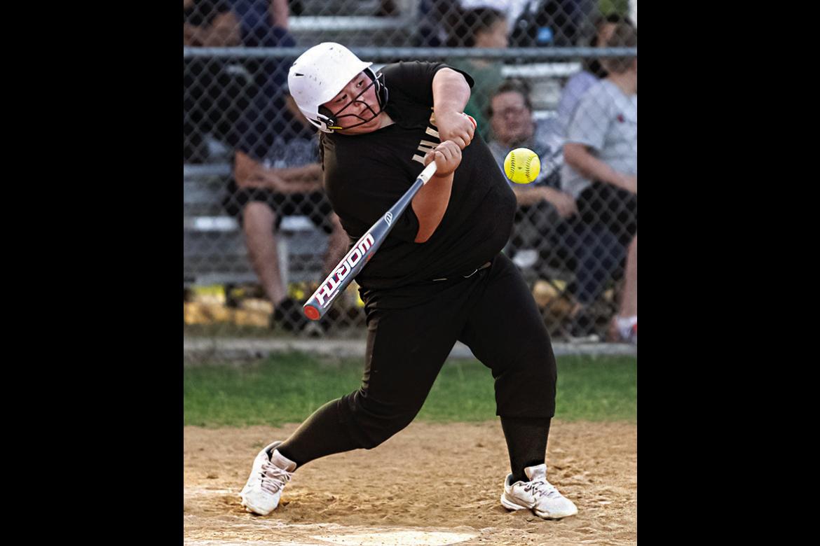 IZZY BIGFEATHER leans into a pitch for the Hugo Lady Buffaloes during a recent game in Hugo against the Antlers Lady Cats. The Lady Cats had it all going their way enroute to a 31-1 victory Hugo News Photo / Bobby Hamill