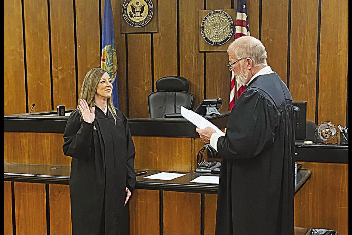 Right: Emily Maxwell Herron gets sworn in as the District 17 District Judge Monday morning in McCurtain County. District 17 covers Choctaw County, McCurtain County and Pushmataha County. Herron lead the Nov. 8 election with 10,321 votes. Contributed Photo