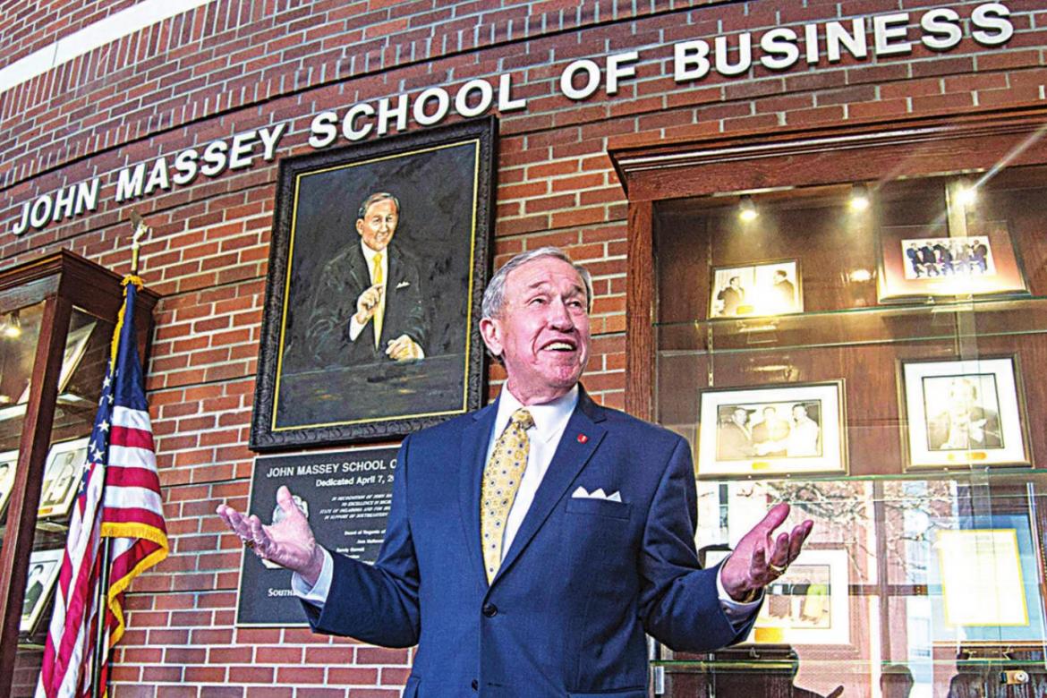 State Regent Emeritus John Massey stands proudly inside the School of Business named for him.