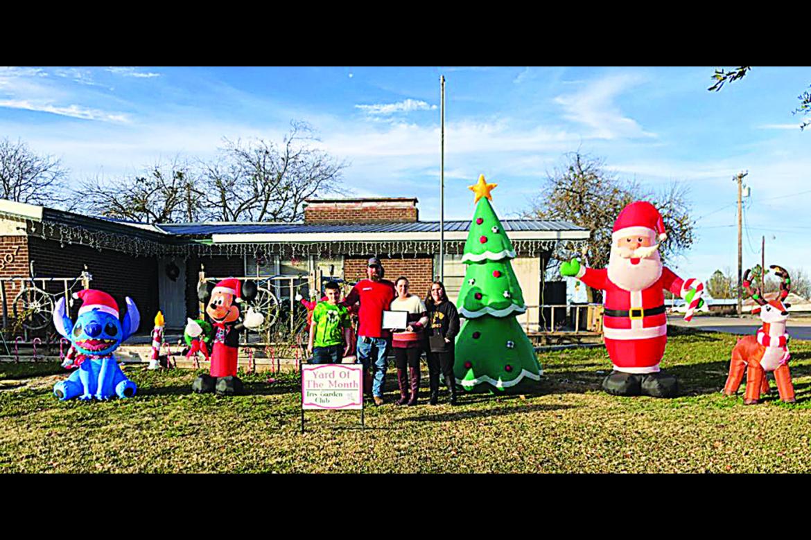 Iris Garden Club Yard of the Month for Christmas was Joshua and Amanda Winters at 1307 E. Duke. Their display featured Santa and sleigh, Christmas trees, snowmen, reindeer and lots of lights. They won a $50 ACE gift card for their efforts.
