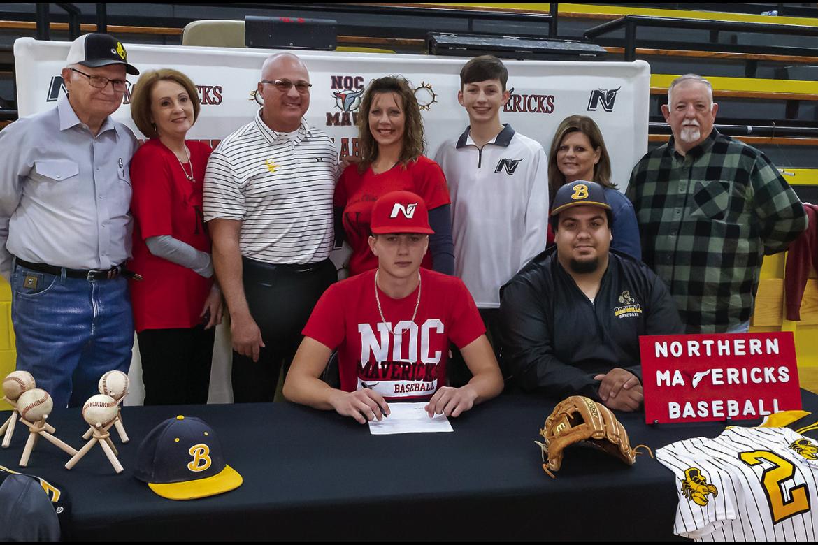 KAMDEN EDGE was joined last week at Boswell by family, friends and teammates as he accepted a scholarship offer to play baseball for the Northern Oklahoma Mavericks. Pictured above with Kamden are: (l-r) Mac Edge, Sharon Edge, Keith Edge, Kylee Edge, Kolson Edge, Karen Griffith, Mike Griffith, and Coach Christian Walsdorf. Hugo News Photo / Bobby Hamill