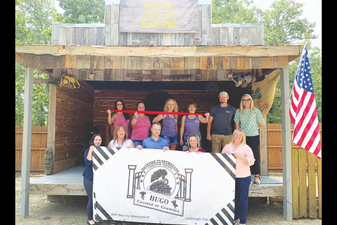 Left: Members of the Hugo Area Chamber of Commerce Board of Directors celebrate the Sawmill Family Pub’s opening alongside owners Melissa and Troy Hickman and their employees on Aug. 5. Photo Courtesy / Hugo Area Chamber of Commerce