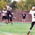 BUFFALO QUARTERBACK JAYKA SANTILLAN connects with wide receiver Gion Balcazar during Friday’s scrimmage against McAlester. Santillan, a senior, has four years QB experience under his belt and will be a force for opposing defenses to reckon with this football season. Hugo News Photo / Stan Stamper
